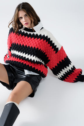 Q2 maglione oversize a righe zig zag rosse