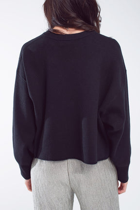 Maglione oversize con scollo a barca in nero