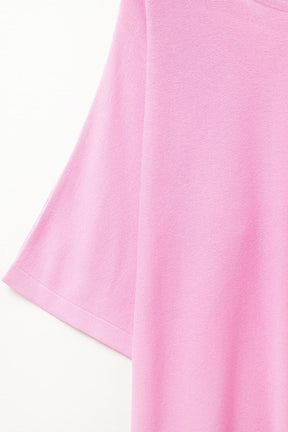 maglione oversize in fucsia con maniche al gomito