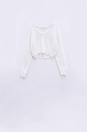 Q2 Maglione panna con ampio scollo a V e dettaglio a treccia