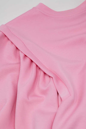 Maglione rosa a maniche lunghe con dettagli cuciti frontalmente sui lati