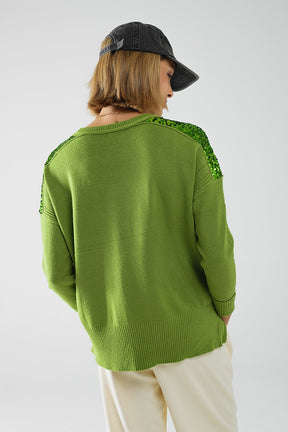 Maglione verde a maniche lunghe con paillettes sulle spalle