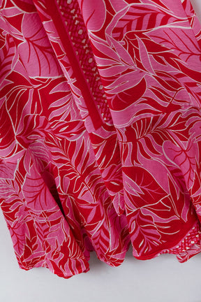 Maxi abito con motivo tropicale e cintura in fucsia