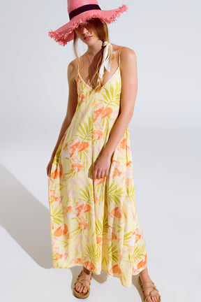 maxi tuta gialla con stampa tropicale