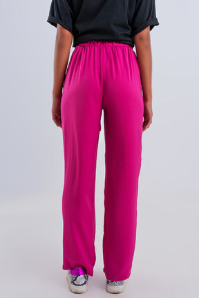 Pantaloni a fondo ampio con cintura fuchsia