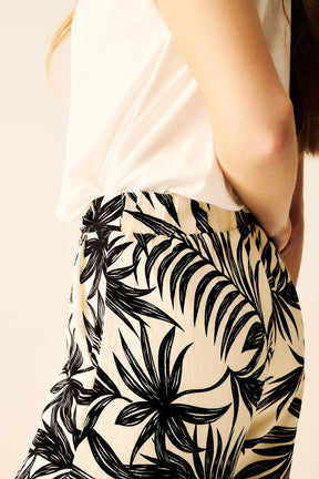 Pantaloni a Gamba Larga in Bianco con Dettaglio Floreale in Nero
