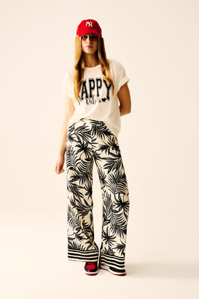 Pantaloni a Gamba Larga in Bianco con Dettaglio Floreale in Nero