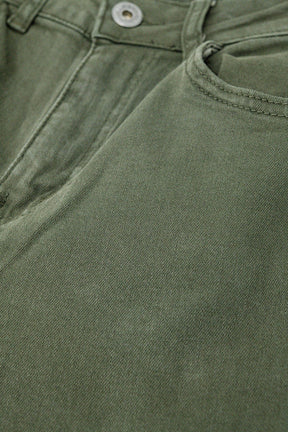 Pantaloni a gamba larga verde militare con stampa leopardata sul fondo