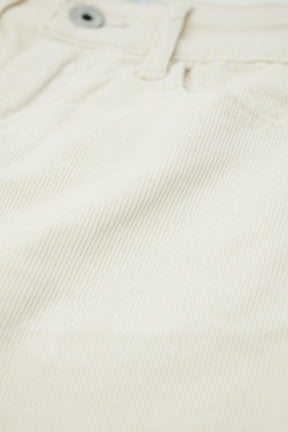 Pantaloni flare in velluto a coste beige chiaro con stampa leopardata sul fondo