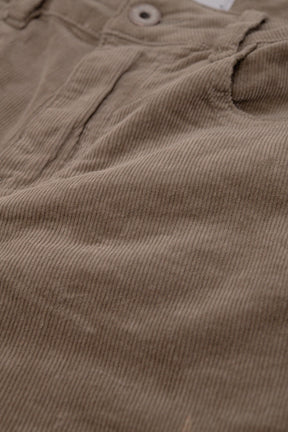 Pantaloni flare in velluto a coste beige scuro con stampa leopardata sul fondo