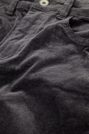 Pantaloni flare in velluto a coste grigio scuro con stampa leopardata sul fondo