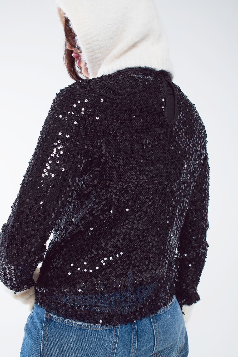 Top con paillettes a maniche lunghe in nero