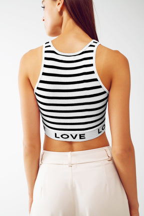 Top corto a righe con scritta Love in bianco