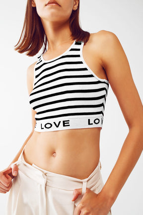 Top corto a righe con scritta Love in bianco