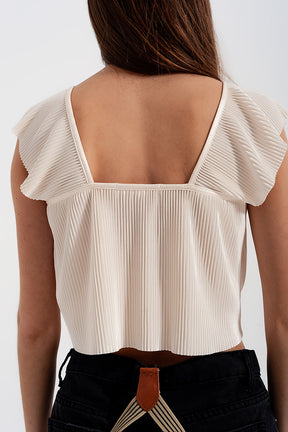 Top corto allacciato sul davanti con arricciature e maniche voluminose color crema