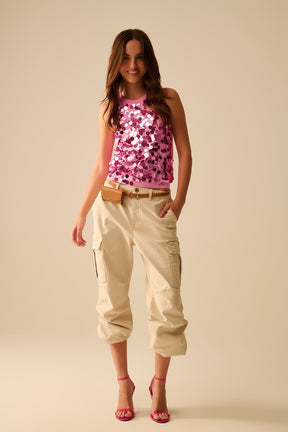 Top in maglia rosa con dettagli in paillettes