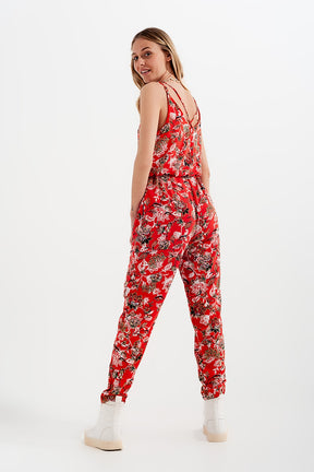 Tuta jumpsuit con spalline sottili e stampa a fiori in rosso