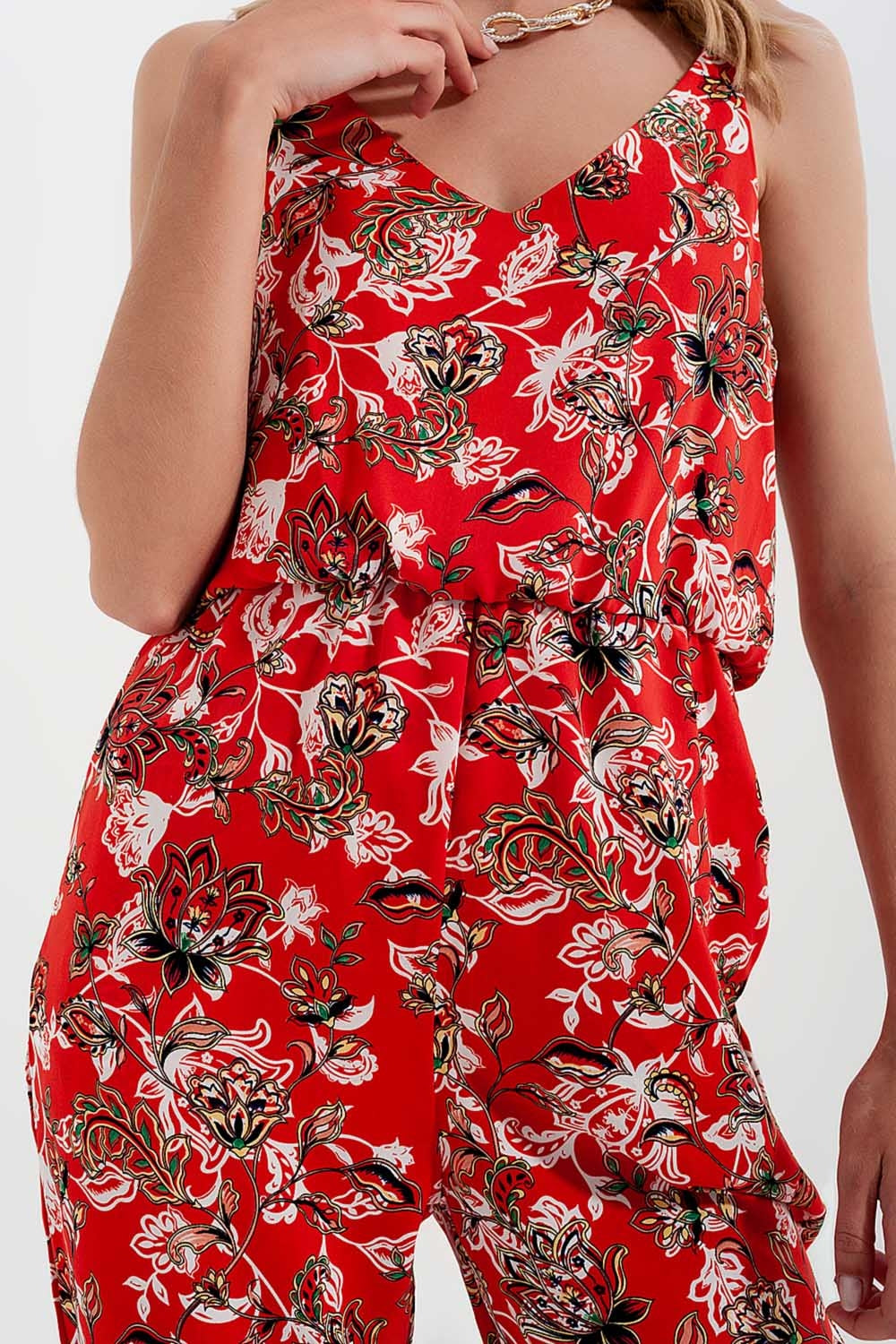 Tuta jumpsuit con spalline sottili e stampa a fiori in rosso