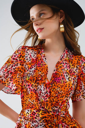 Vestito corto arancione multicolore con top incrociato con stampa animalier