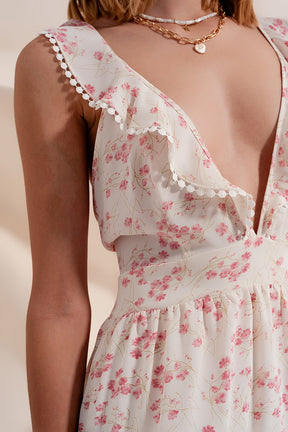 Vestito svasato corto in plumetis con scollo profondo color rosa a fiori